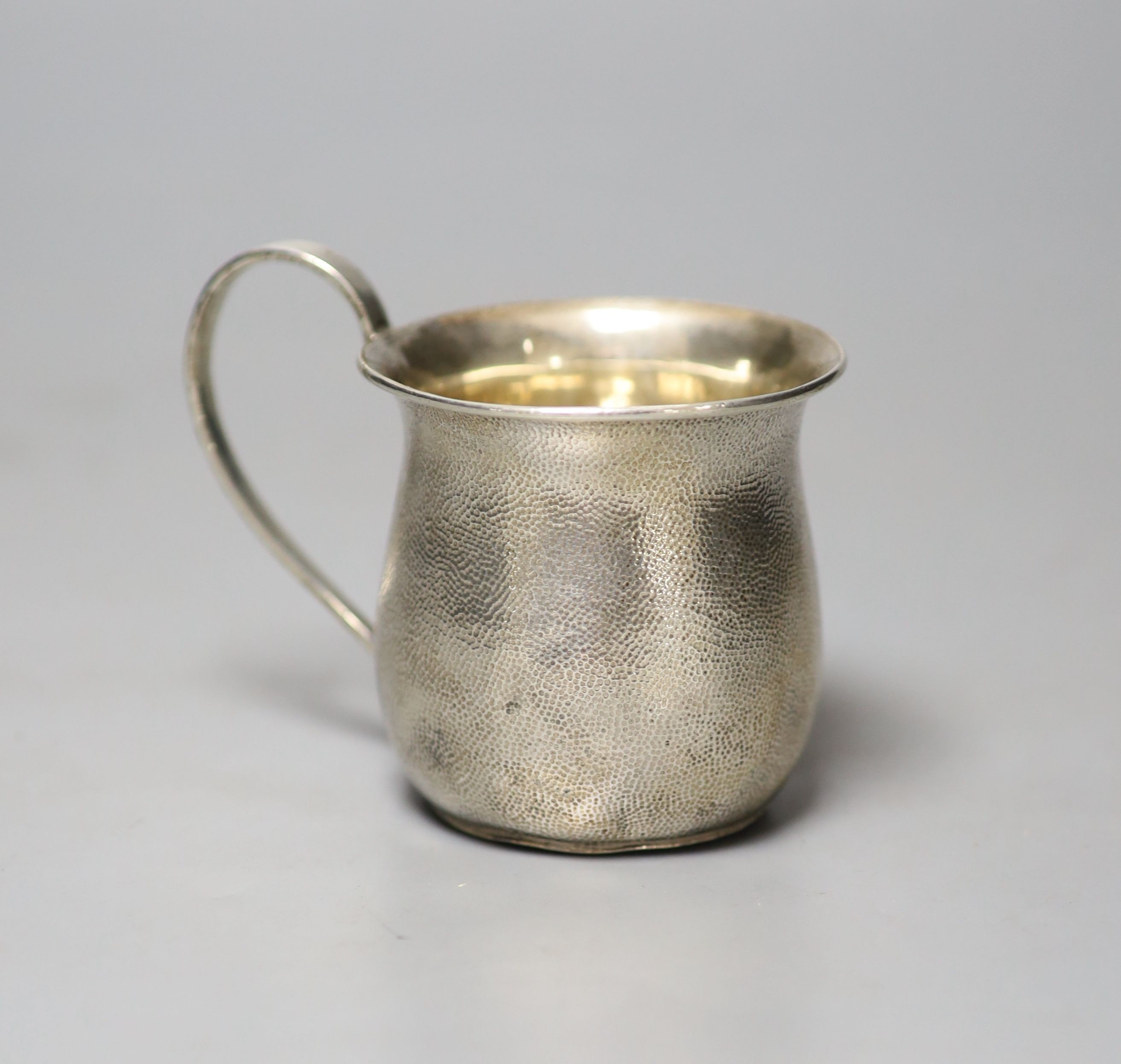 A Chinese planished white metal small mug, stamped 'WK90', 7cm, 80 grams.